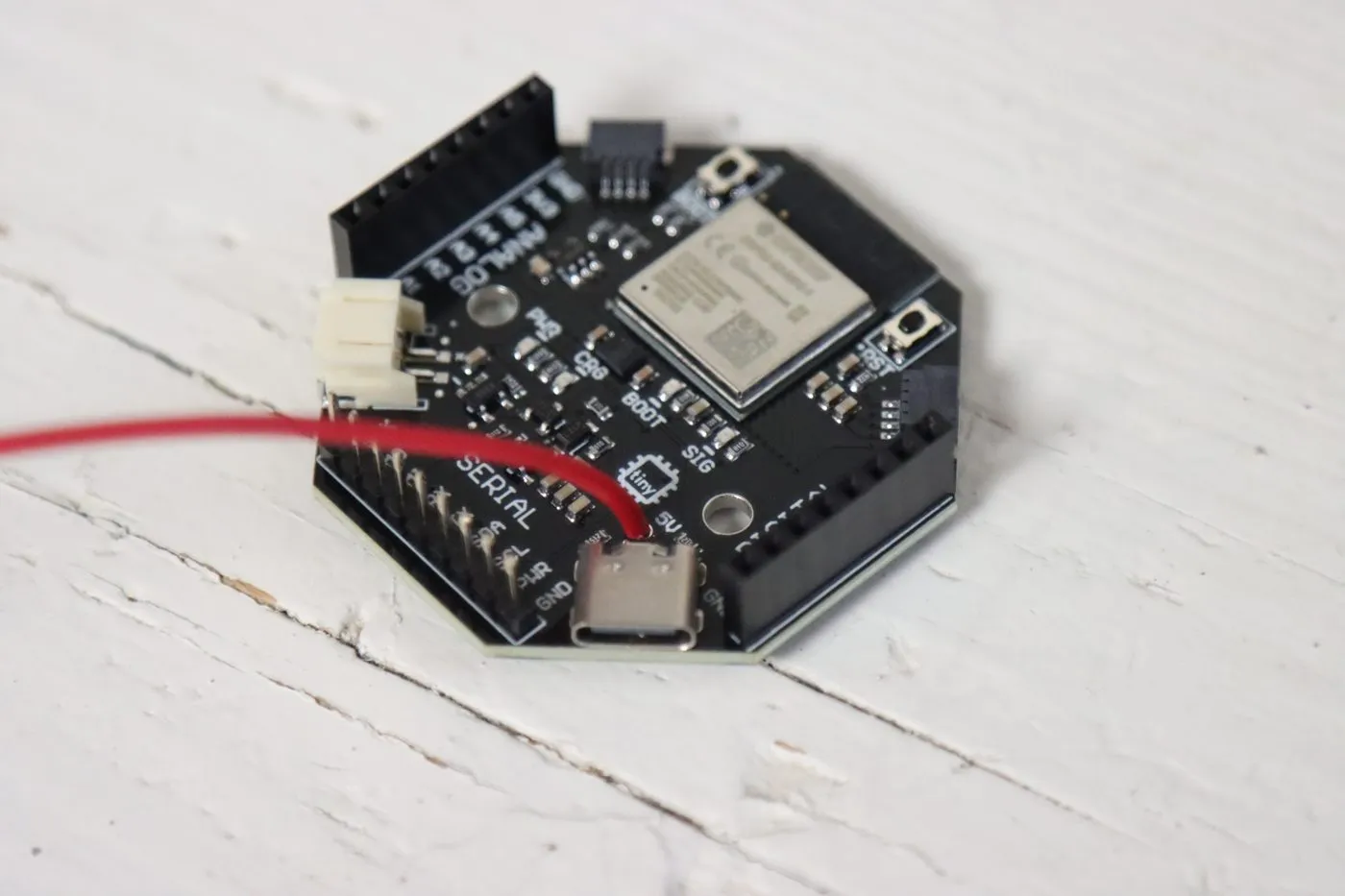 Red wire coming out of the 5V hole next to the tinyCore's USB-C port