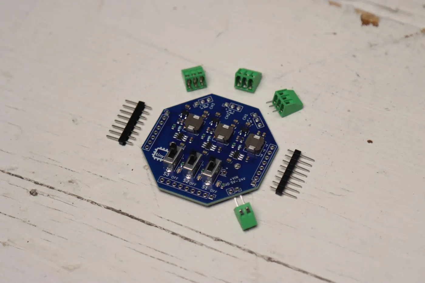tinyGlow board with headers and screw terminals laid out