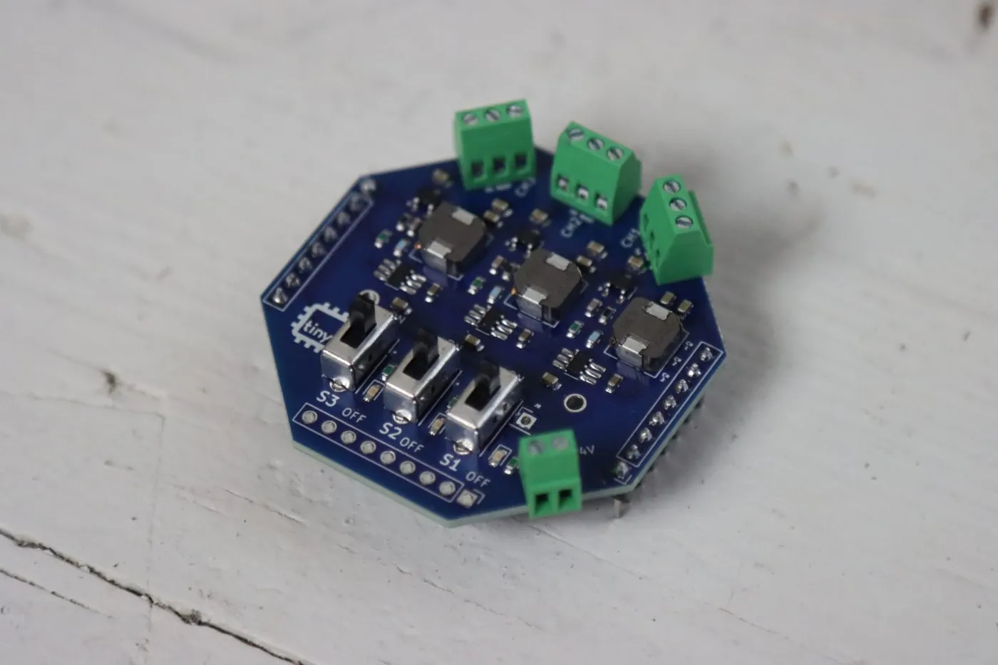 tinyGlow with all four screw terminals soldered on
